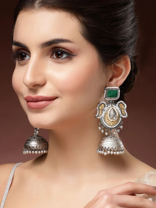 Classic Silver and Gold-Plated Jhumka Earrings with Green Carved Stone